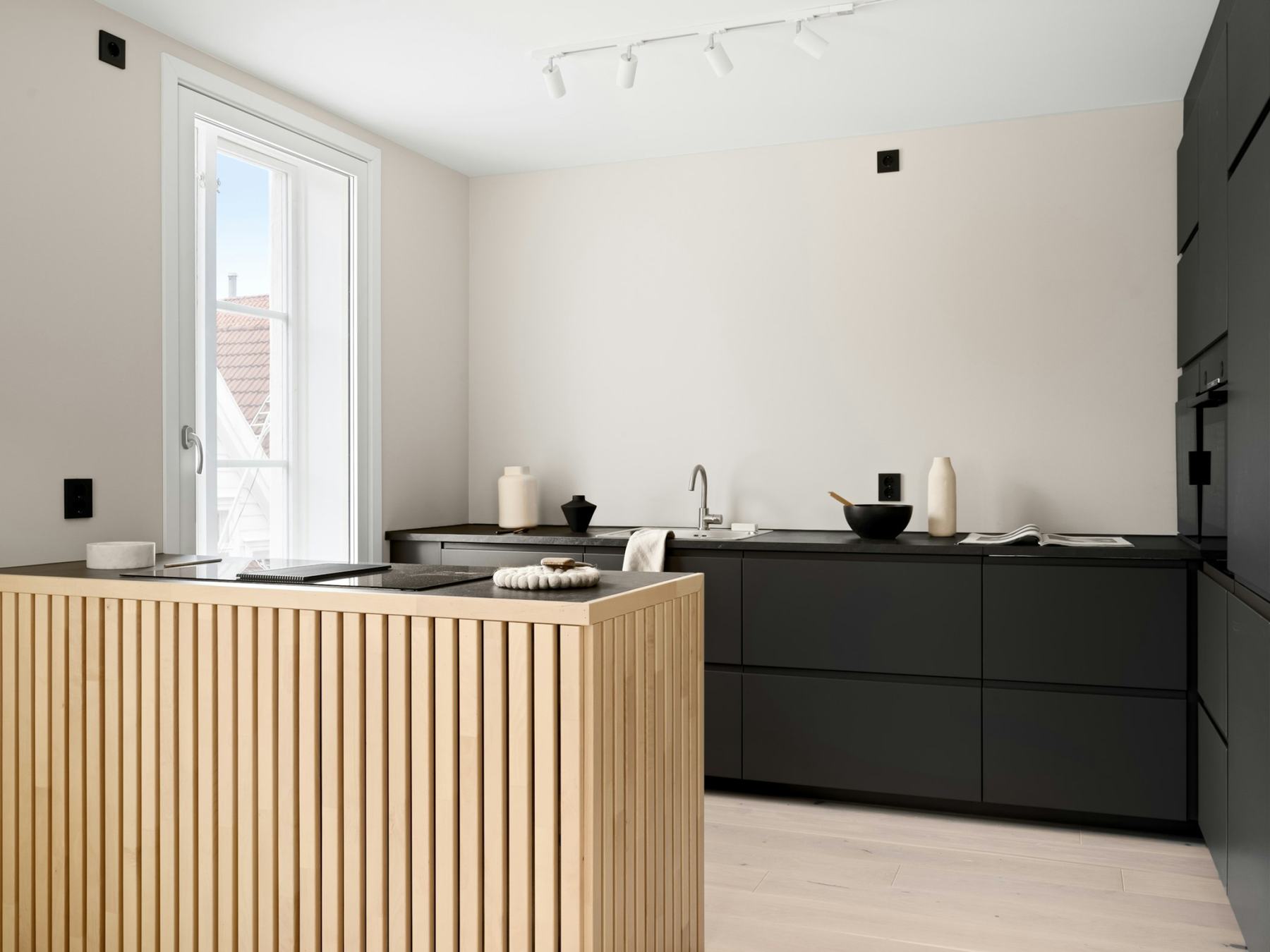 Kitchen with oak island and dark cabinets