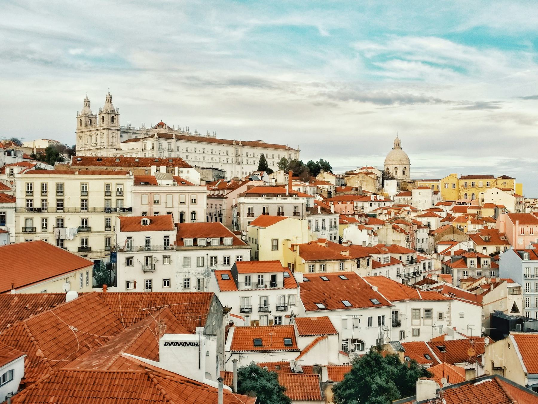 Lisbon rooftops and church domes on a clear day