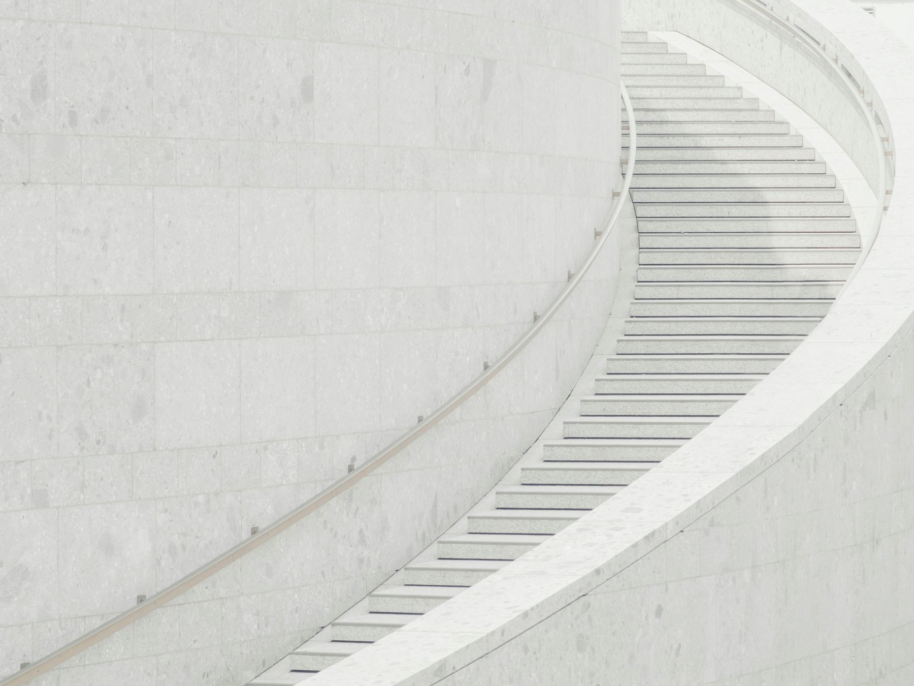 White stone staircase curving upward