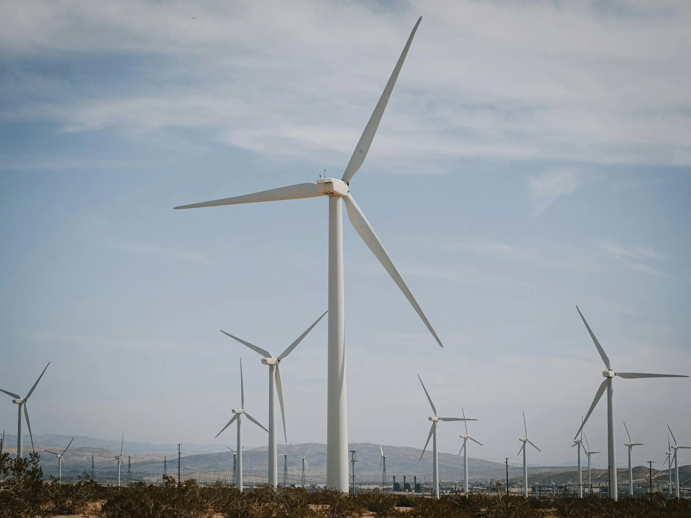 Wind turbines against a cloudy sky